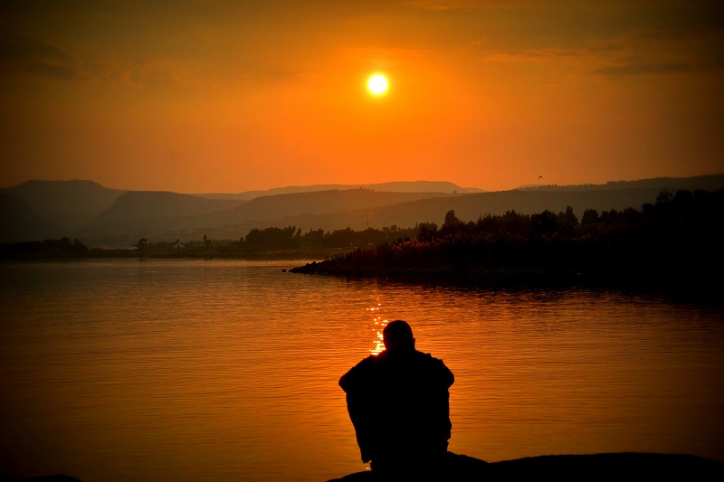 coping with guilt in addiction recovery man contemplating at sunset